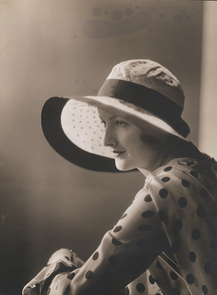 Vogue Magazine Photographer - Woman in Polka Dot Shirt and Hat