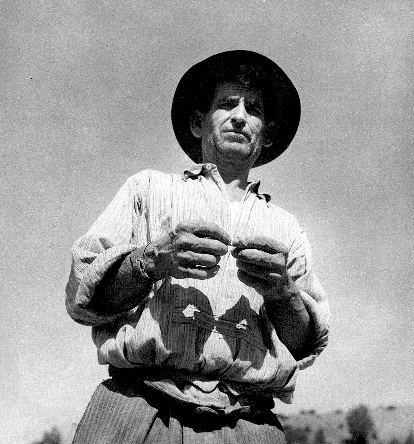 Laure Albin-Guillot - Man Rolling Cigarette (From the Series "Aspects de la France")