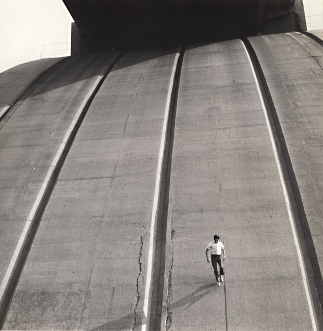 Arthur Tress - Boy Runs down Side of Support Arches of Bronx Whitestone Bridge, Bronx, NY