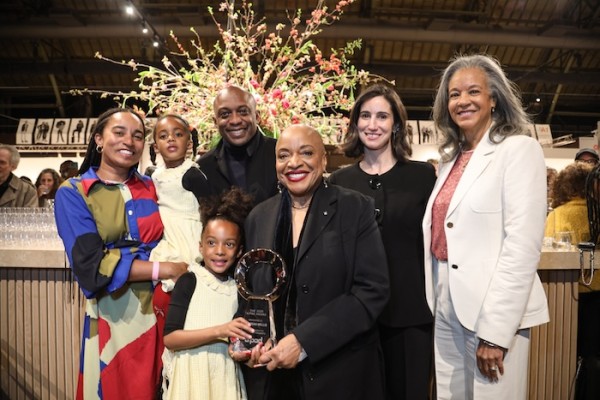 The 2026 AIPAD Award was presented during the Opening Evening by former board member Arnika Dawkins and AIPAD Executive Director Lydia Melamed Johnson to Dr. Deborah Willis. Dr. Willis, joined by her family, accepted the honor. (Photo by Erica Price. Courtesy of AIPAD.)